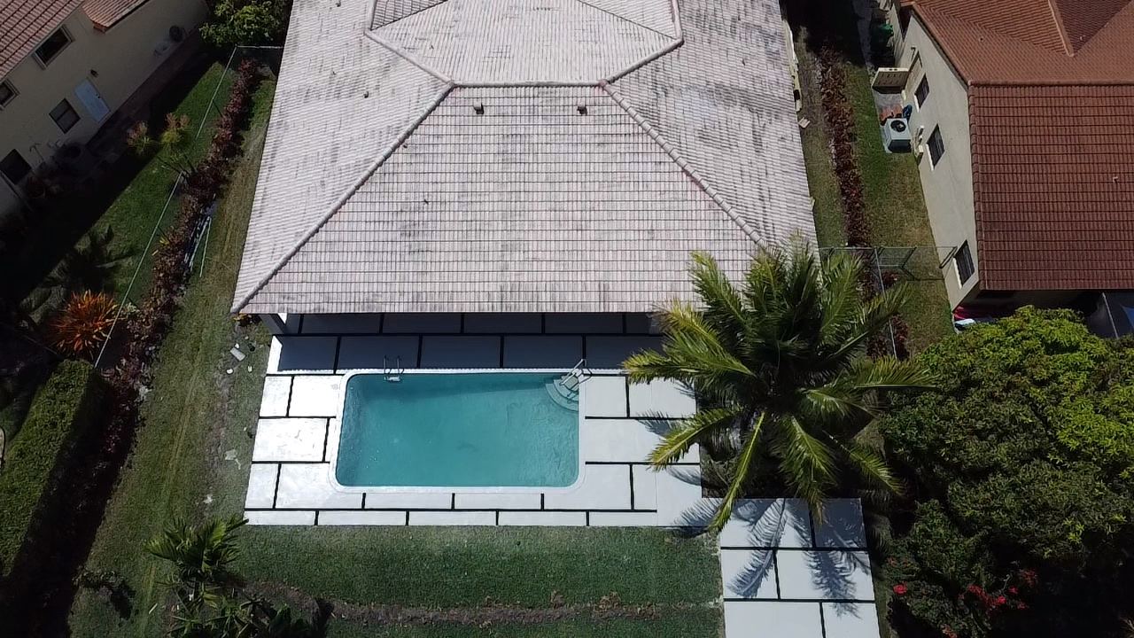 Aerial view of a backyard pool and concrete deck, Plantation or Coral Springs, Florida