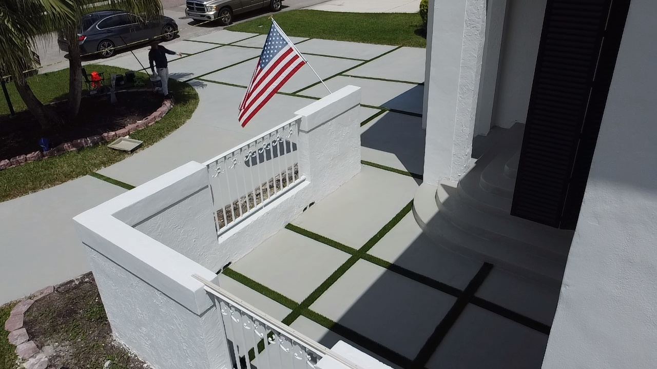 Concrete driveway viewed from a second-floor balcony, Plantation or Coral Springs, Florida