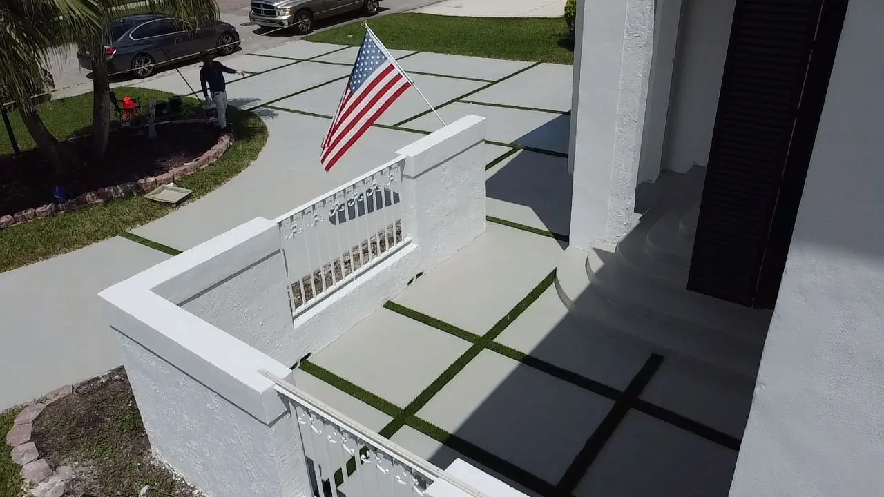 Concrete driveway viewed from a second-floor balcony, Plantation or Coral Springs, Florida