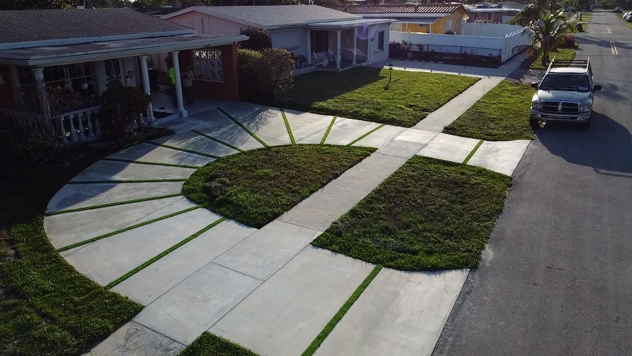 Circular concrete driveway with grass joints by Concrete Solutions Today, Broward County, FL