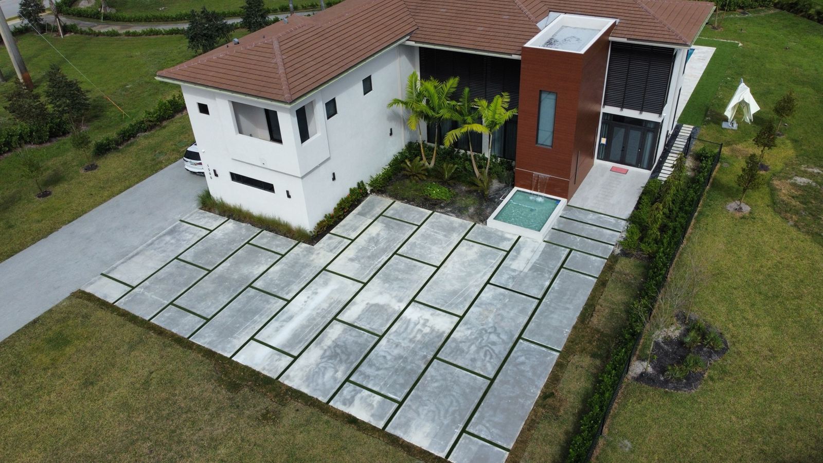 Concrete slab patio at a modern home by Concrete Solutions Today, Broward County, FL