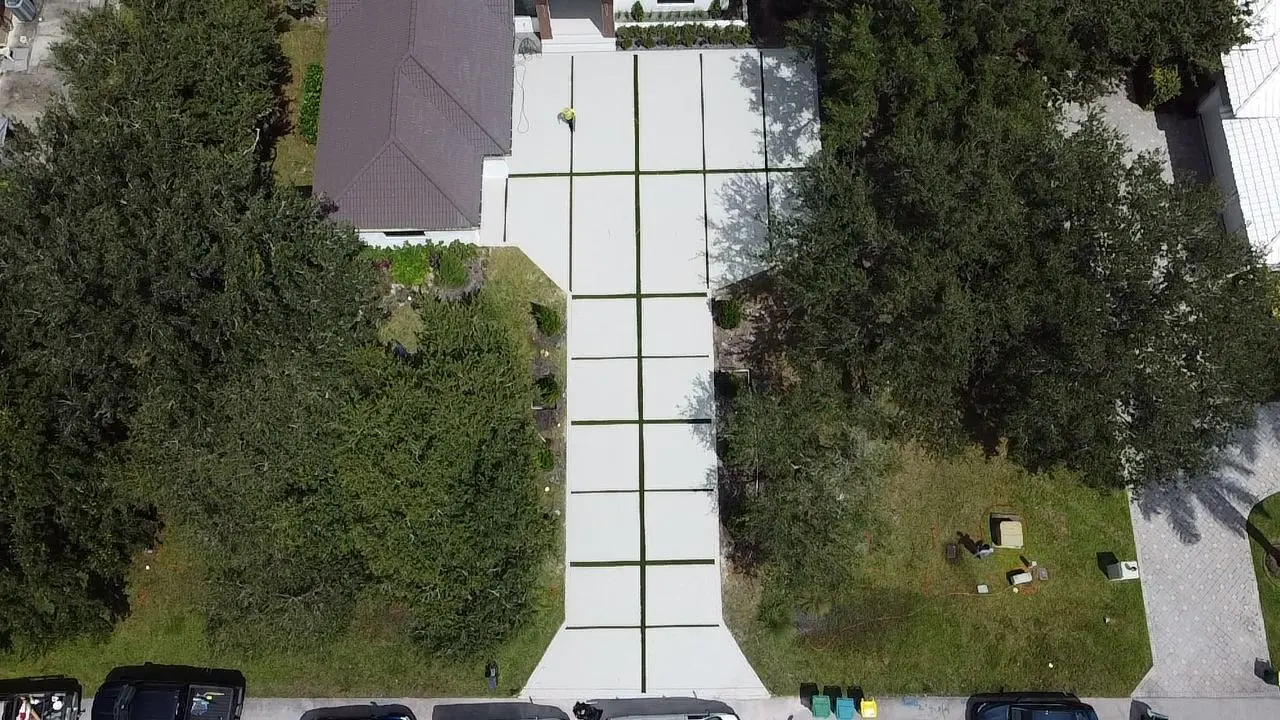 Long concrete driveway with grass joints, aerial view, Plantation or Coral Springs, Florida