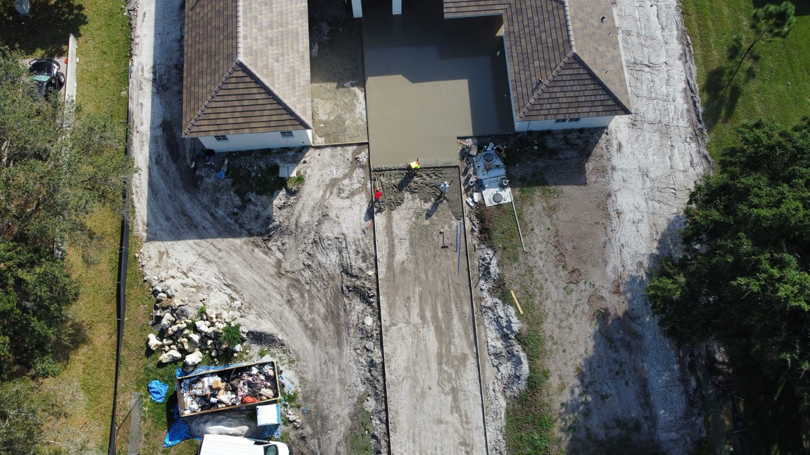 Aerial view of the driveway pour, garage to street by Concrete Solutions Today, Parkland, FL