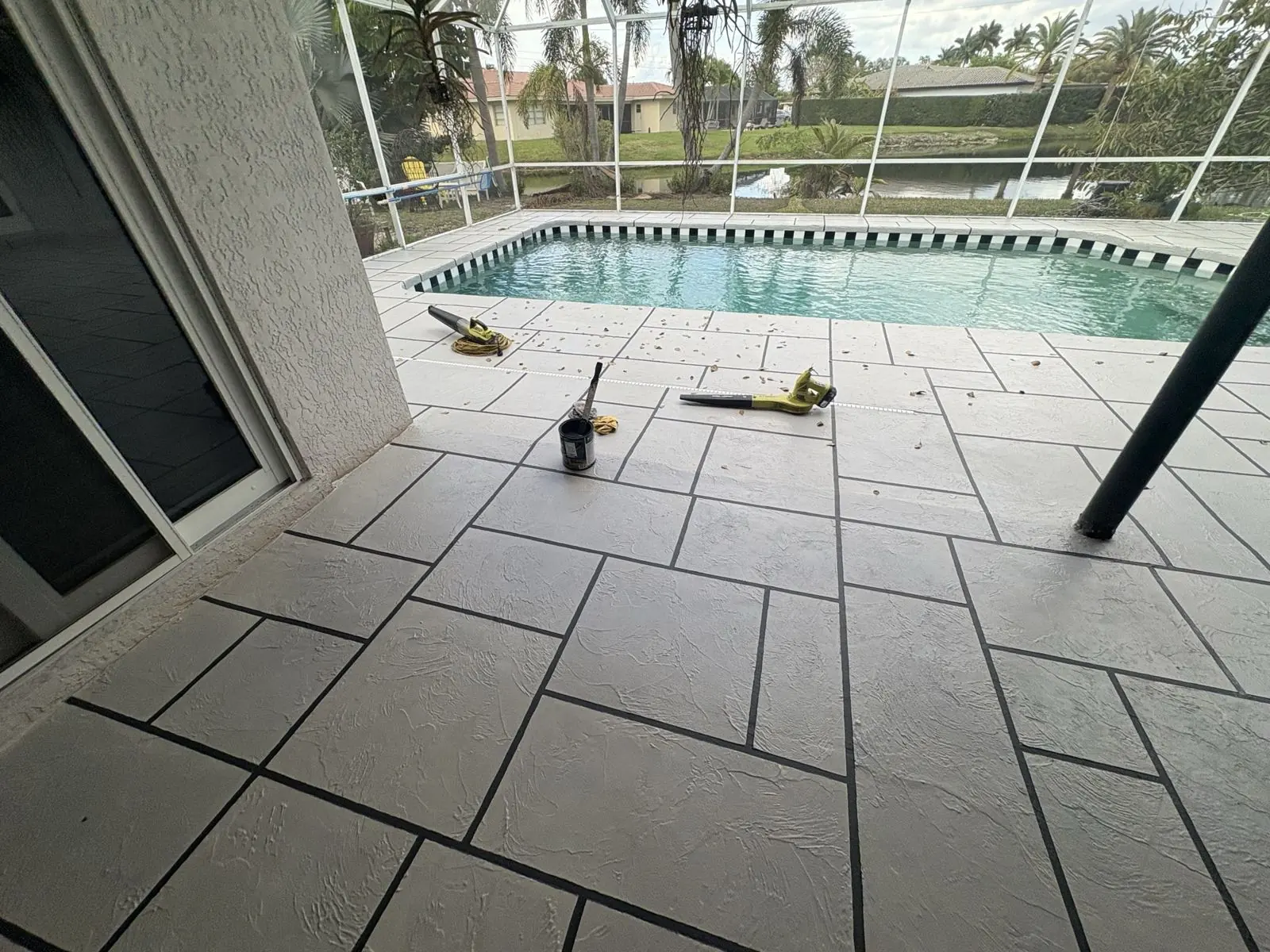 Resurfaced poolside deck with a tile-pattern finish, Broward County, Florida
