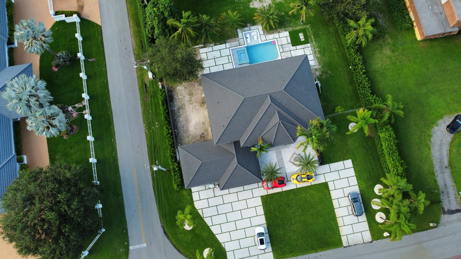 Pool and patio with concrete slabs, aerial view, Plantation or Coral Springs, Florida