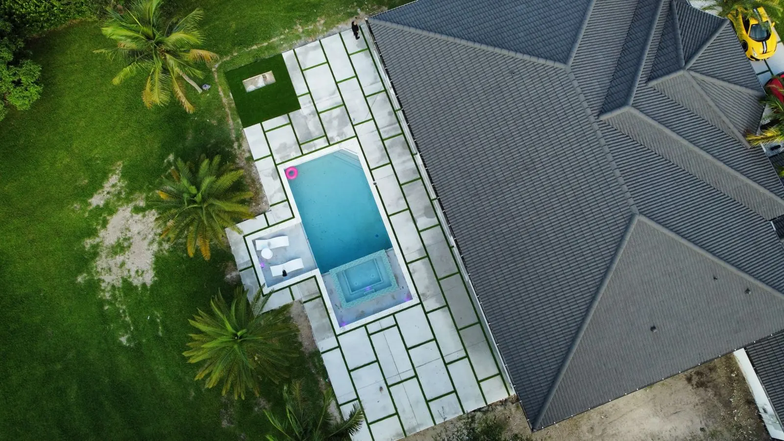 Rectangular pool with concrete slab deck, aerial view, Plantation or Coral Springs, Florida