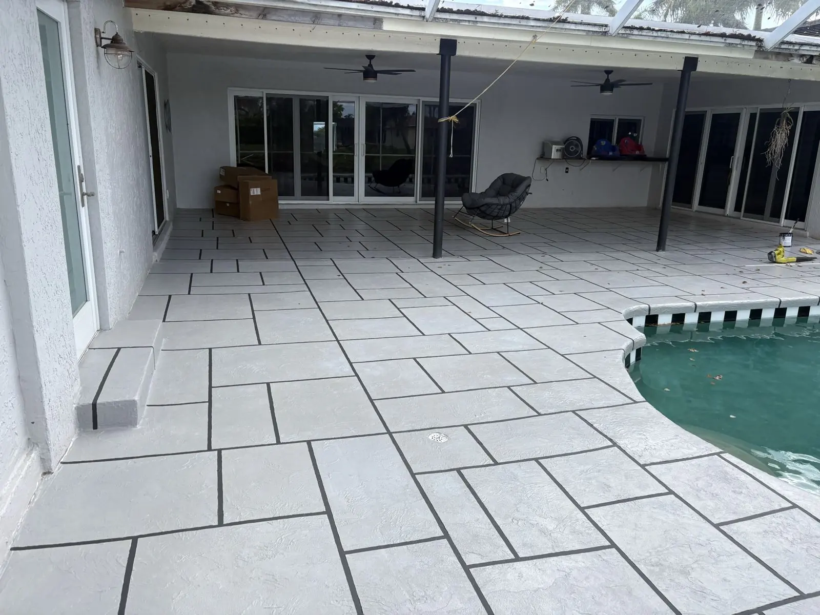 Resurfaced covered patio with a tile-pattern finish, Broward County, Florida