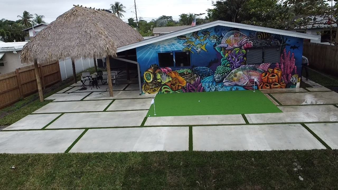 Tiki hut cabana over a concrete and artificial turf patio, Plantation or Coral Springs, Florida